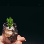 Savings jar with coins and financial planning concept