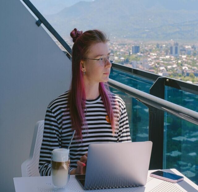 Person working on laptop to make money online in 2026
